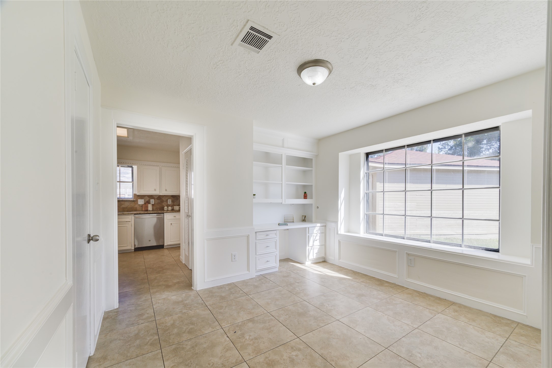 18318 Ella Boulevard Spring, TX 77388 - Photo 21 of 50 a view of an empty room and a kitchen