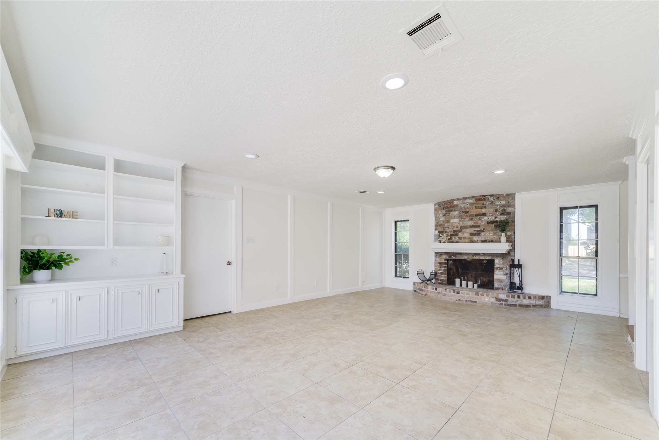 18318 Ella Boulevard Spring, TX 77388 - Photo 26 of 50 an empty room with furniture and a fireplace