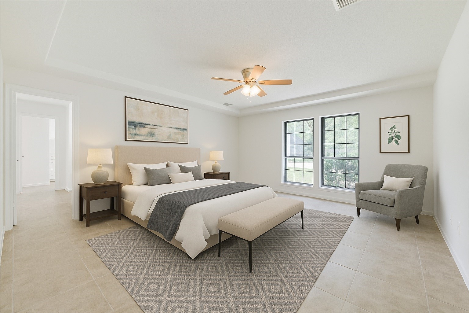 18318 Ella Boulevard Spring, TX 77388 - Photo 28 of 50 a spacious bedroom with a bed and a couch