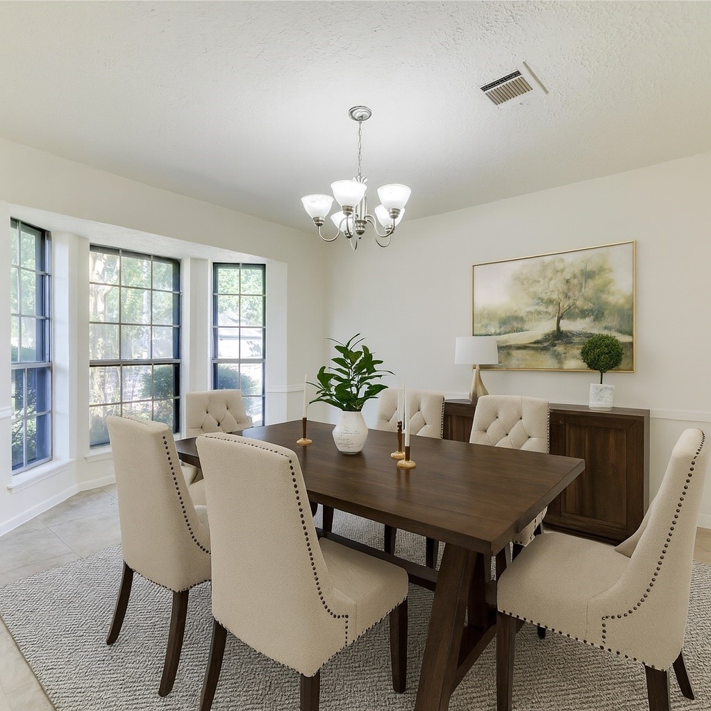 18318 Ella Boulevard Spring, TX 77388 - Photo 3 of 50 a view of a dining room with furniture and chandelier
