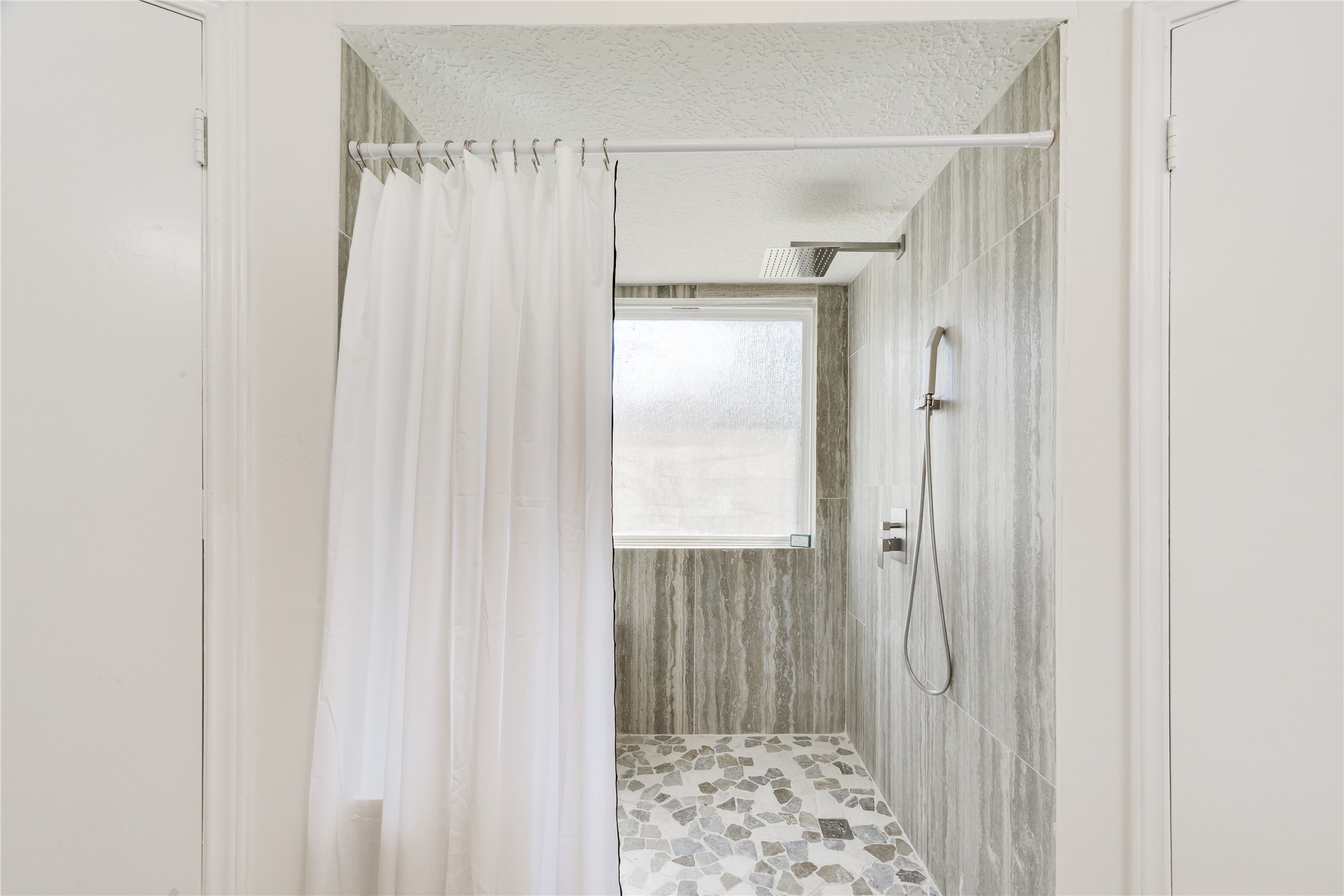 18318 Ella Boulevard Spring, TX 77388 - Photo 34 of 50 a bathroom with a shower and a sink