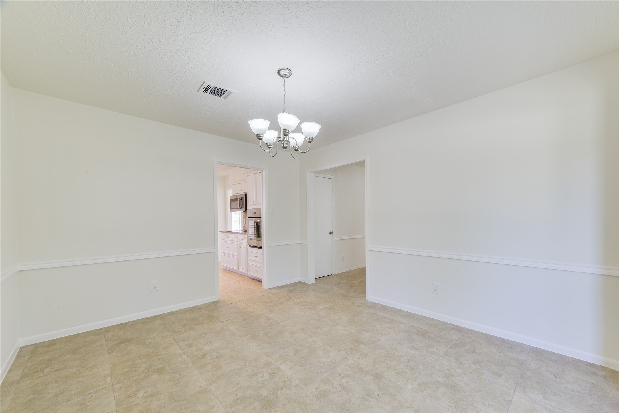 18318 Ella Boulevard Spring, TX 77388 - Photo 7 of 50 a view of a chandelier in big room and chandelier