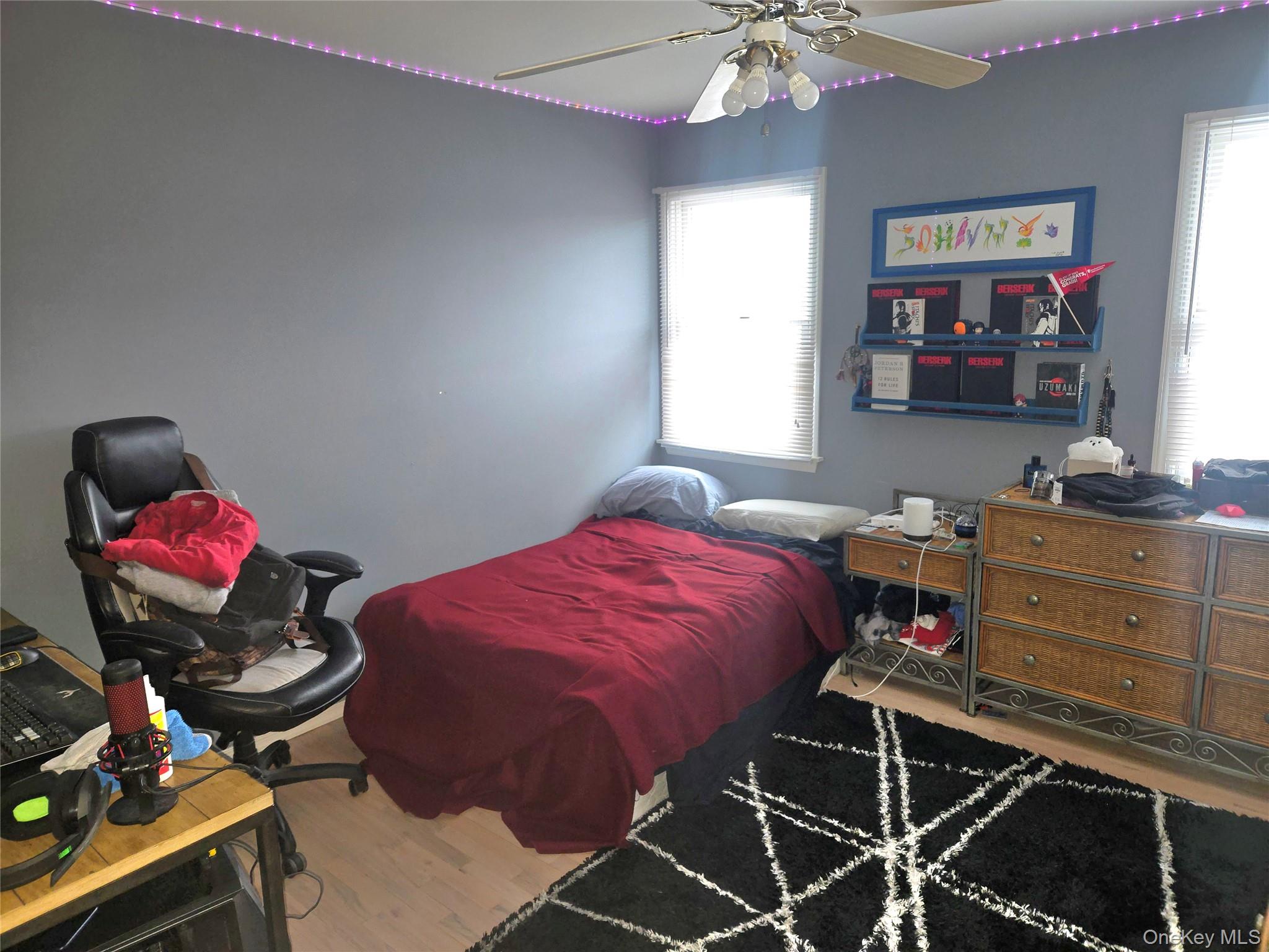 22 Rustic Road Yaphank, NY 11980 - Photo 20 of 35 Bedroom featuring wood finished floors and a ceiling fan