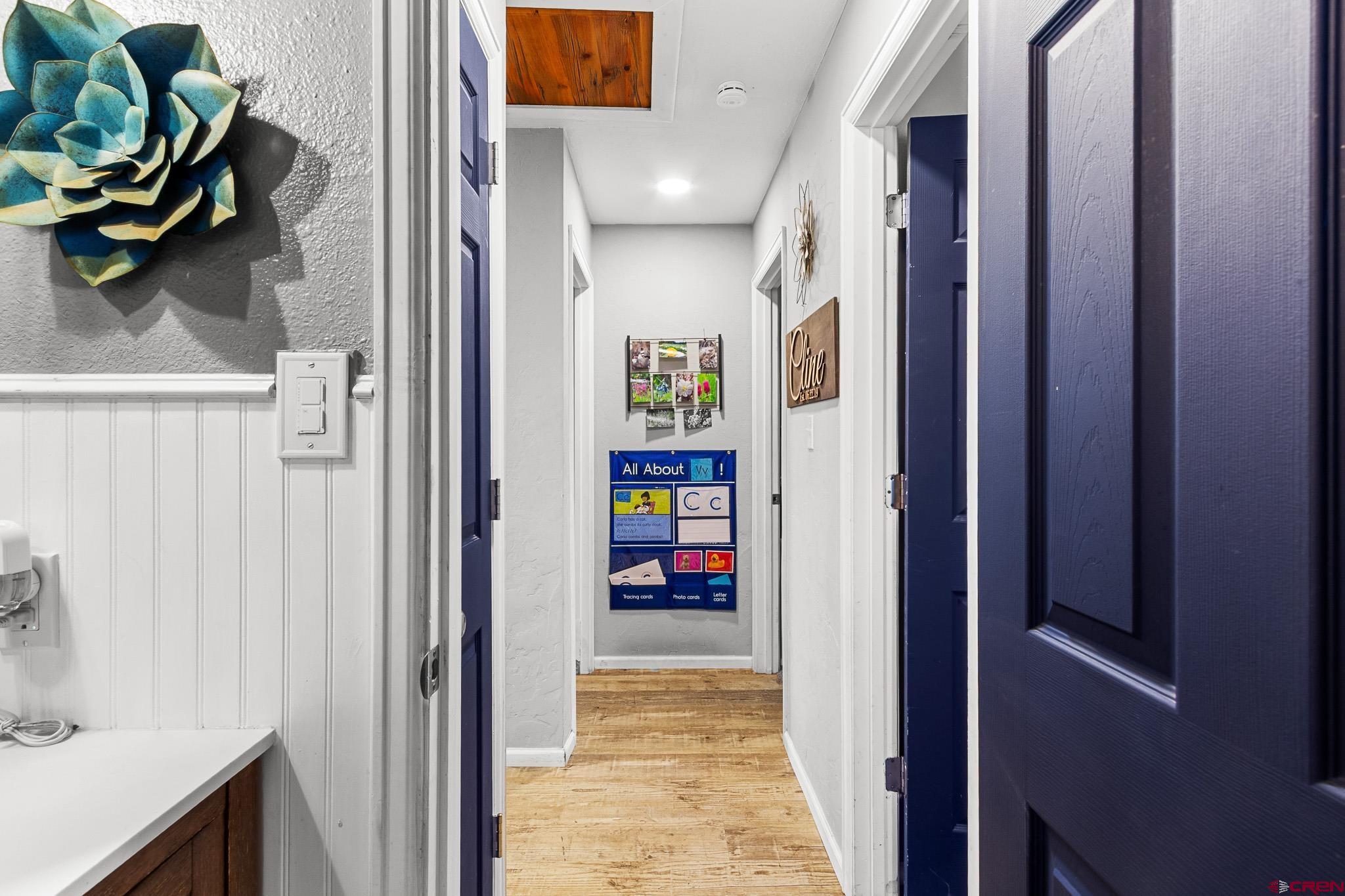 13330 L Road Montrose, CO 81401 - Photo 12 of 19 a view of a hallway with wooden floor and stairs