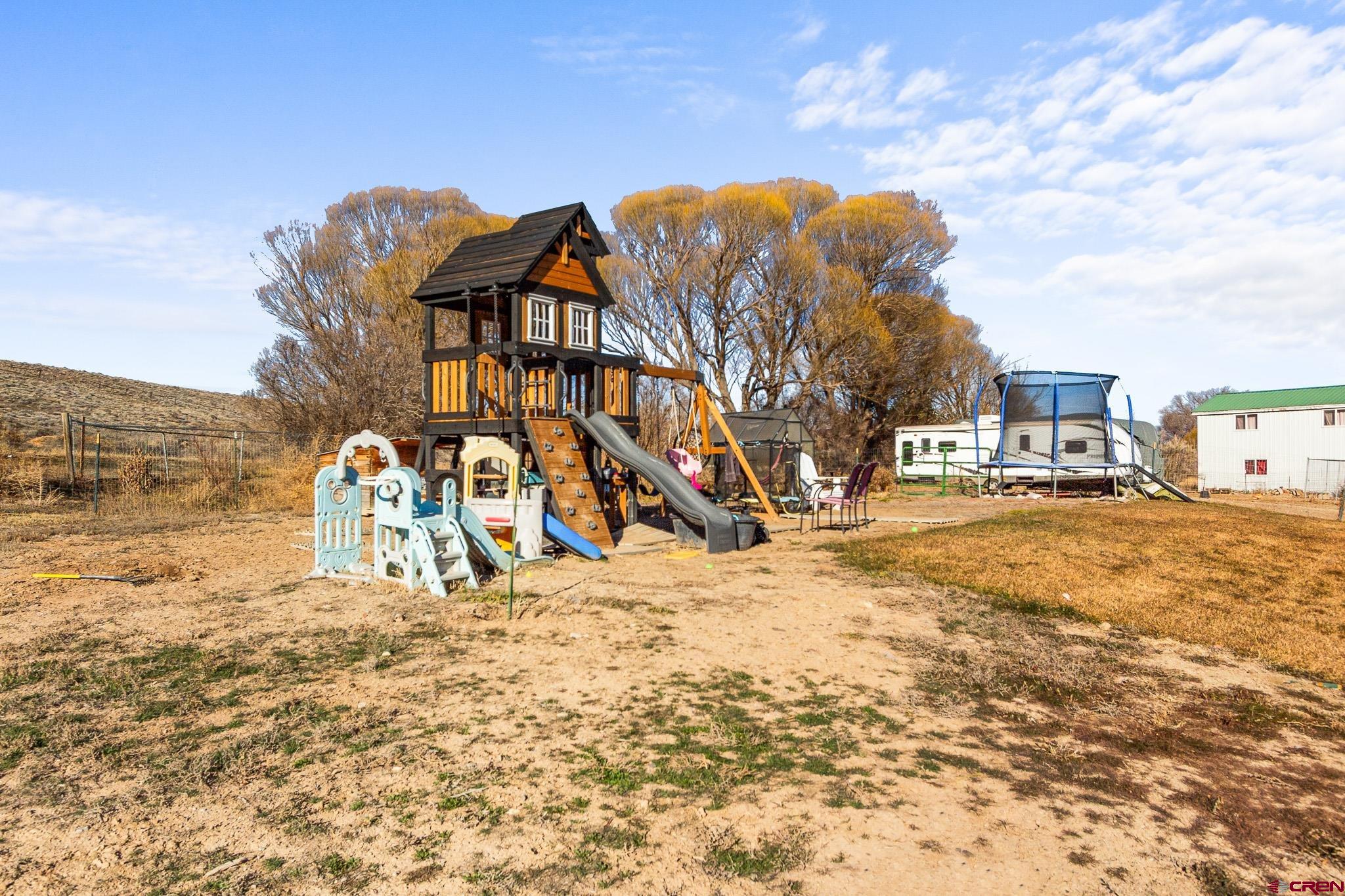 13330 L Road Montrose, CO 81401 - Photo 16 of 19 a view of a large building next to a road