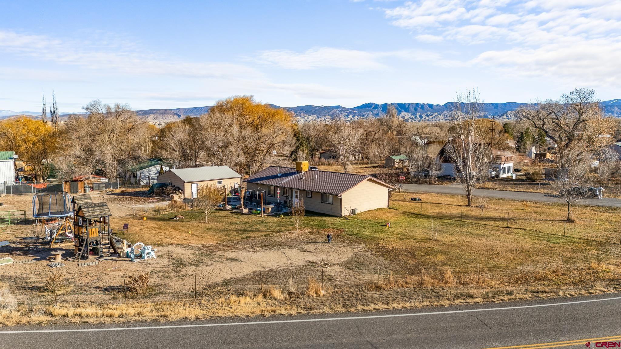 13330 L Road Montrose, CO 81401 - Photo 4 of 19 a view of a town with mountains in the background