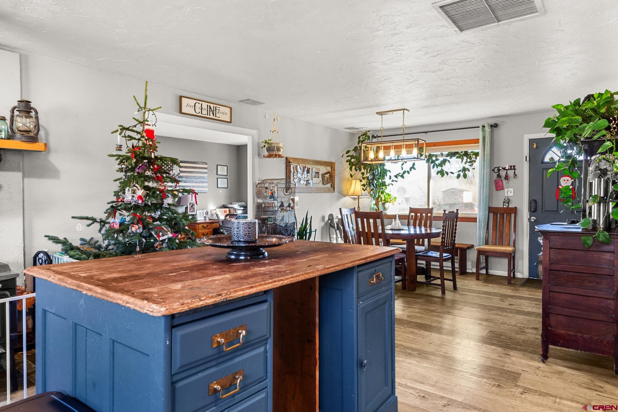 13330 L Road Montrose, CO 81401 - Photo 8 of 19 a view of living room kitchen with furniture and wooden floor