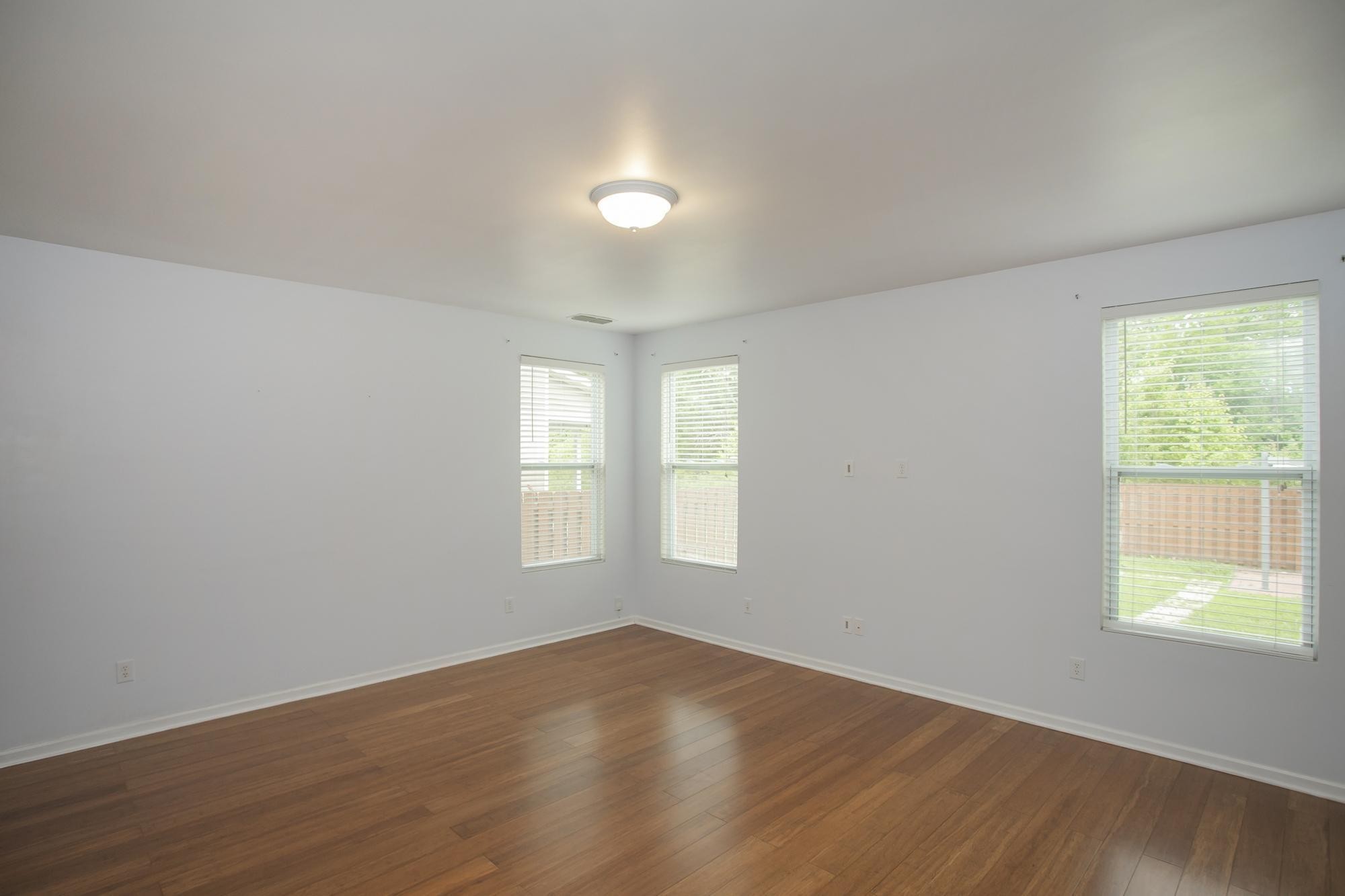 3601 Harpeth Springs Drive Nashville, TN 37221 - Photo 16 of 55 an empty room with wooden floor and windows
