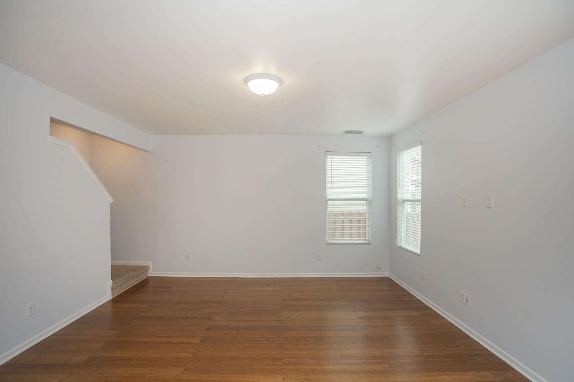3601 Harpeth Springs Drive Nashville, TN 37221 - Photo 17 of 55 an empty room with wooden floor and windows