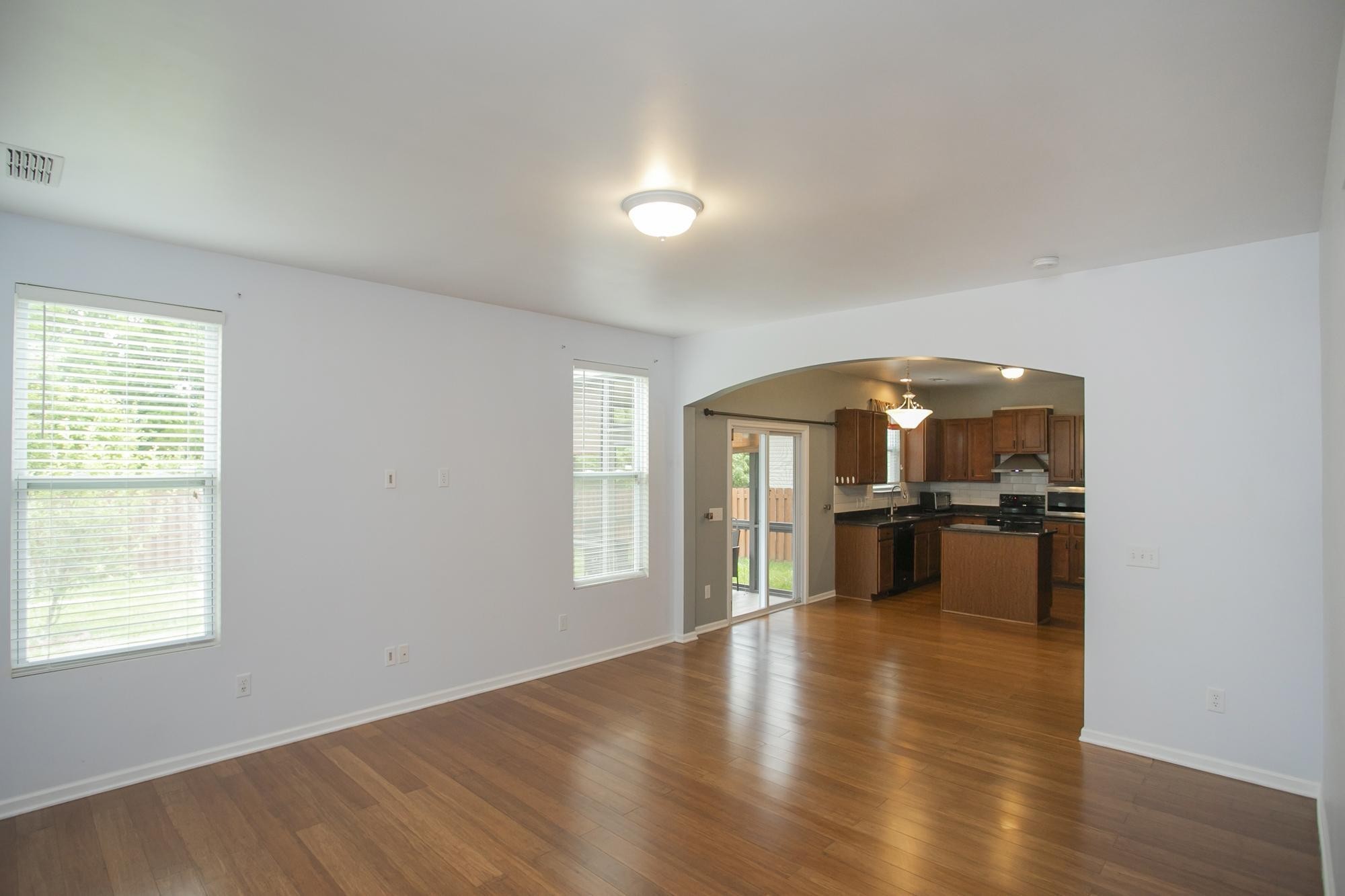 3601 Harpeth Springs Drive Nashville, TN 37221 - Photo 19 of 55 an empty room with wooden floor and windows