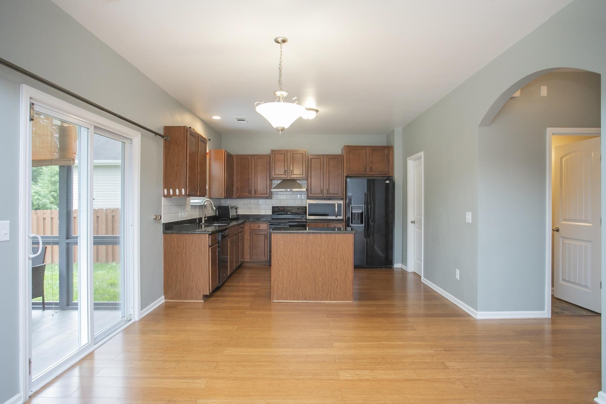 3601 Harpeth Springs Drive Nashville, TN 37221 - Photo 20 of 55 a view of a kitchen with granite countertop stainless steel appliances and a chandelier