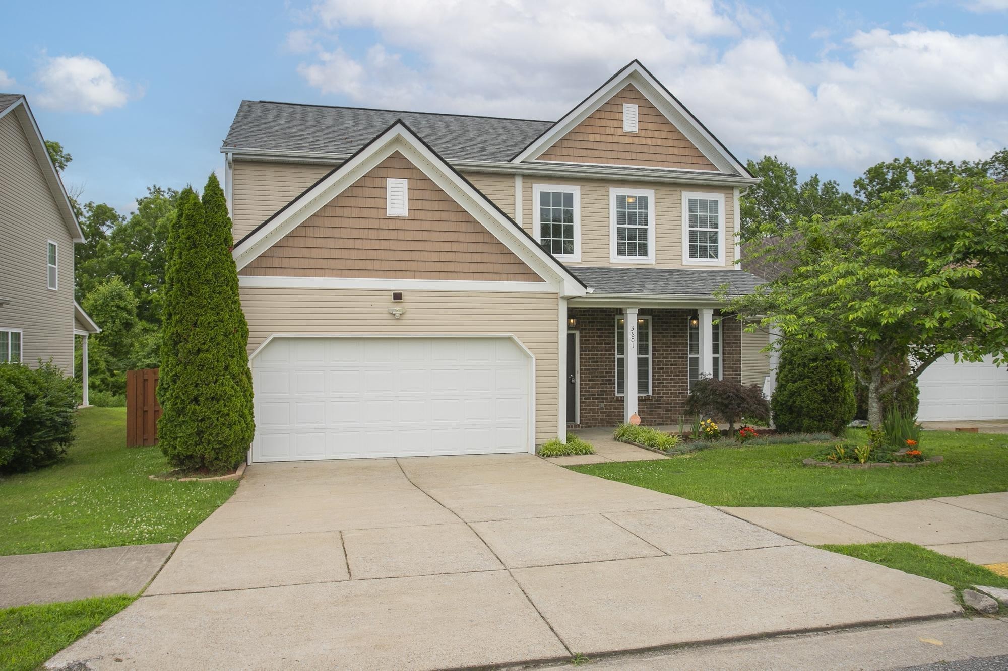 3601 Harpeth Springs Drive Nashville, TN 37221 - Photo 2 of 55 a front view of a house with a yard and trees