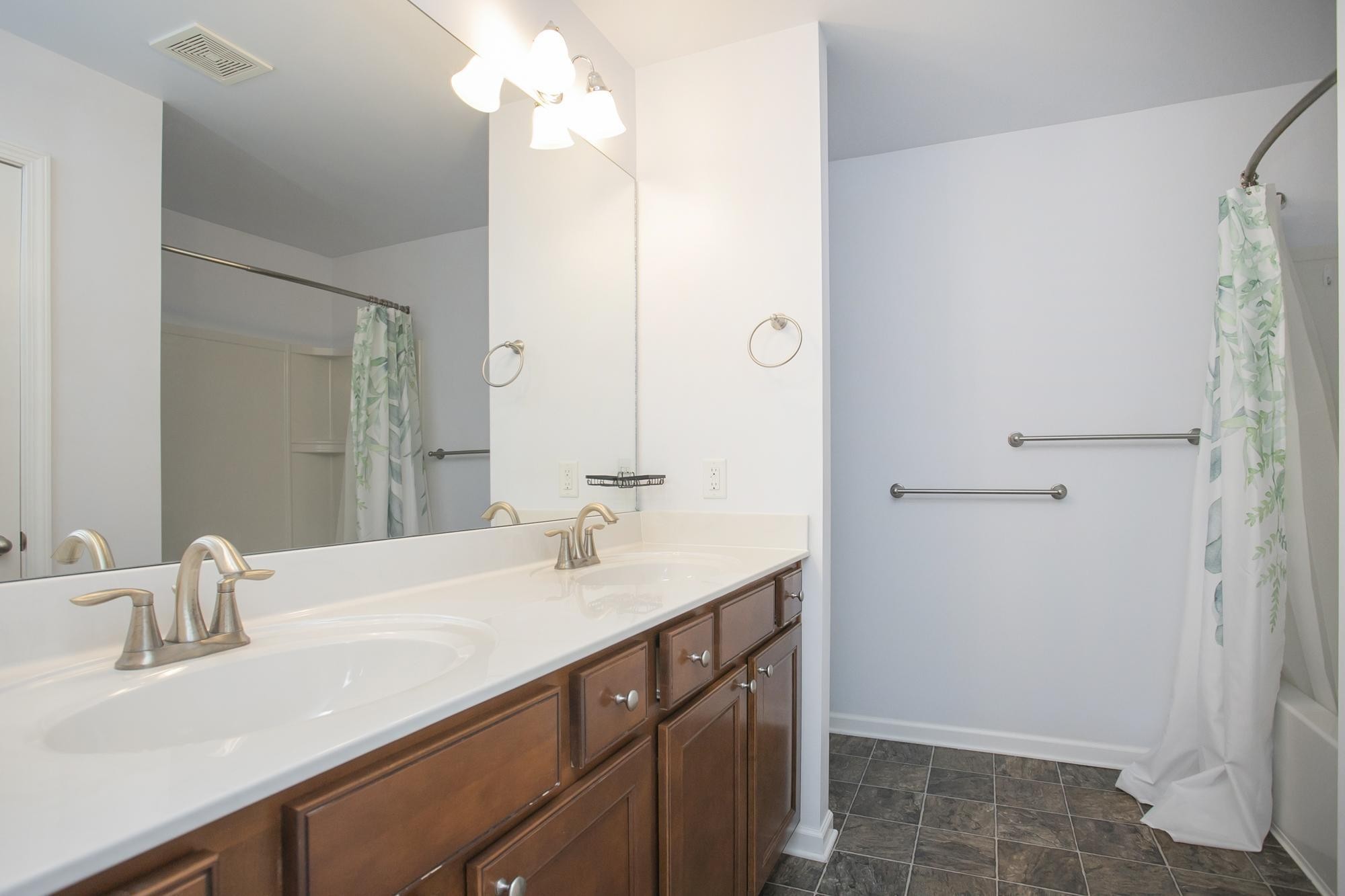 3601 Harpeth Springs Drive Nashville, TN 37221 - Photo 30 of 55 a bathroom with a sink and a mirror