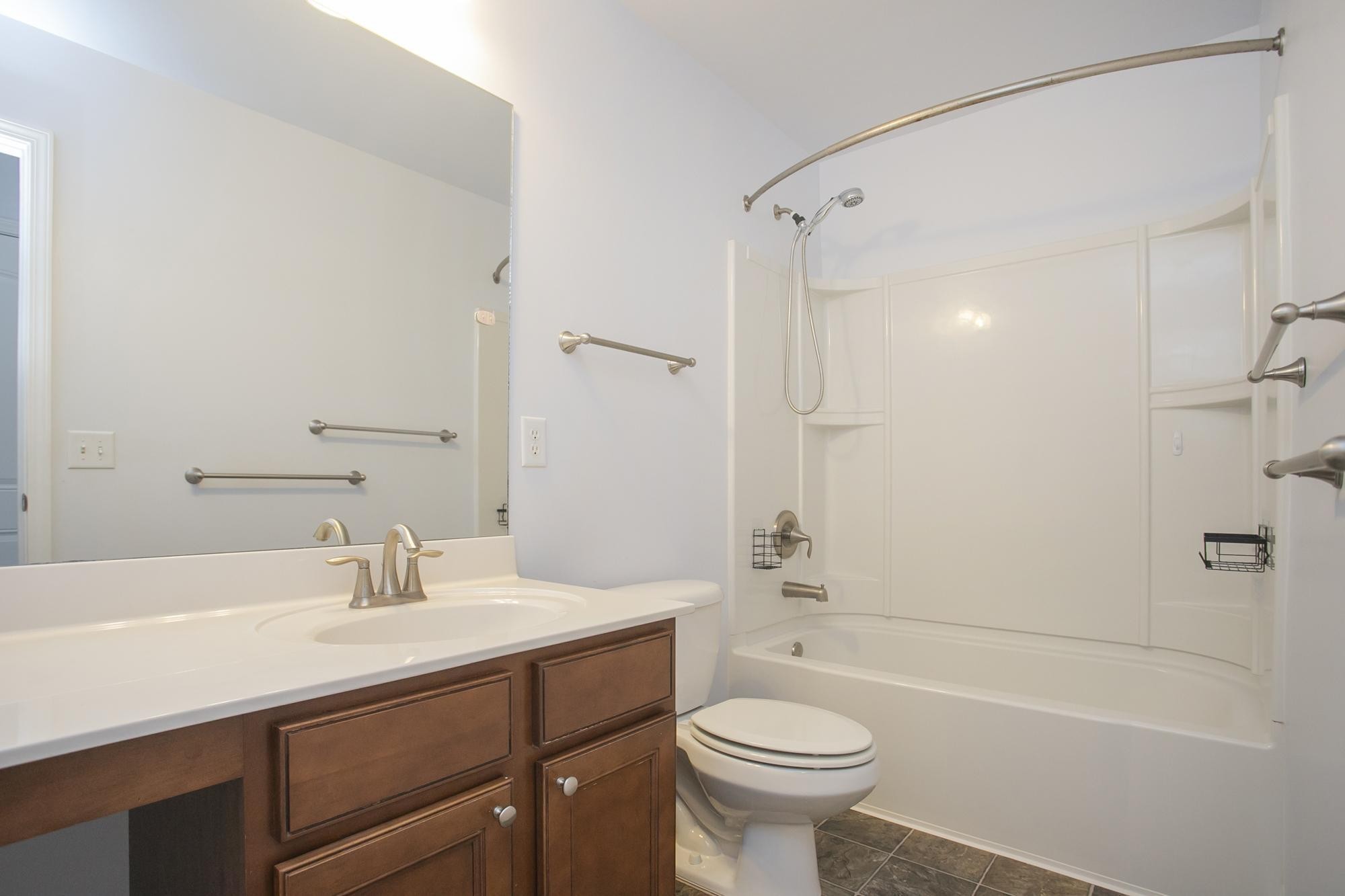 3601 Harpeth Springs Drive Nashville, TN 37221 - Photo 36 of 55 a bathroom with a sink mirror toilet and bathtub