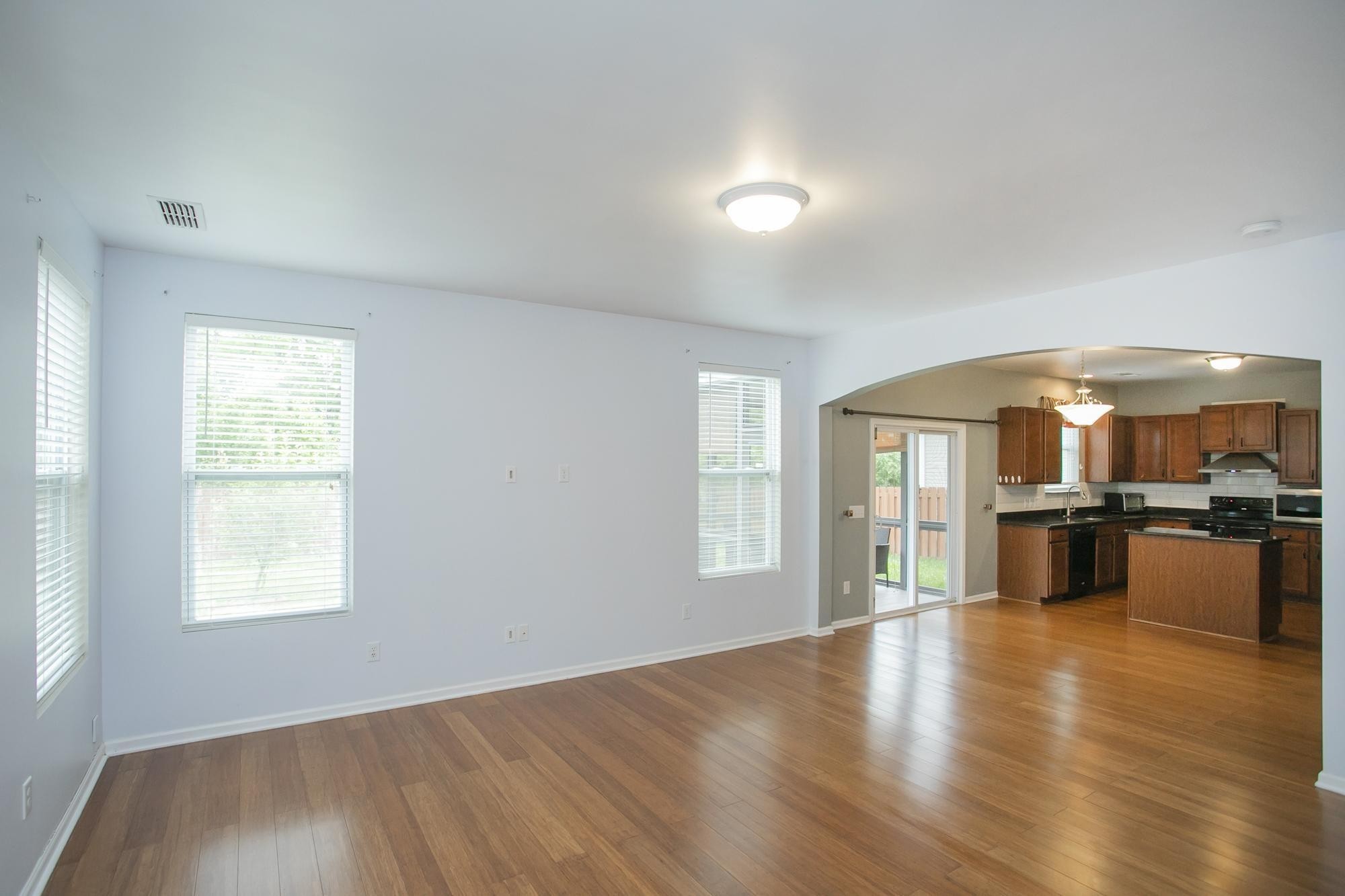 3601 Harpeth Springs Drive Nashville, TN 37221 - Photo 45 of 55 an empty room with windows and wooden floor