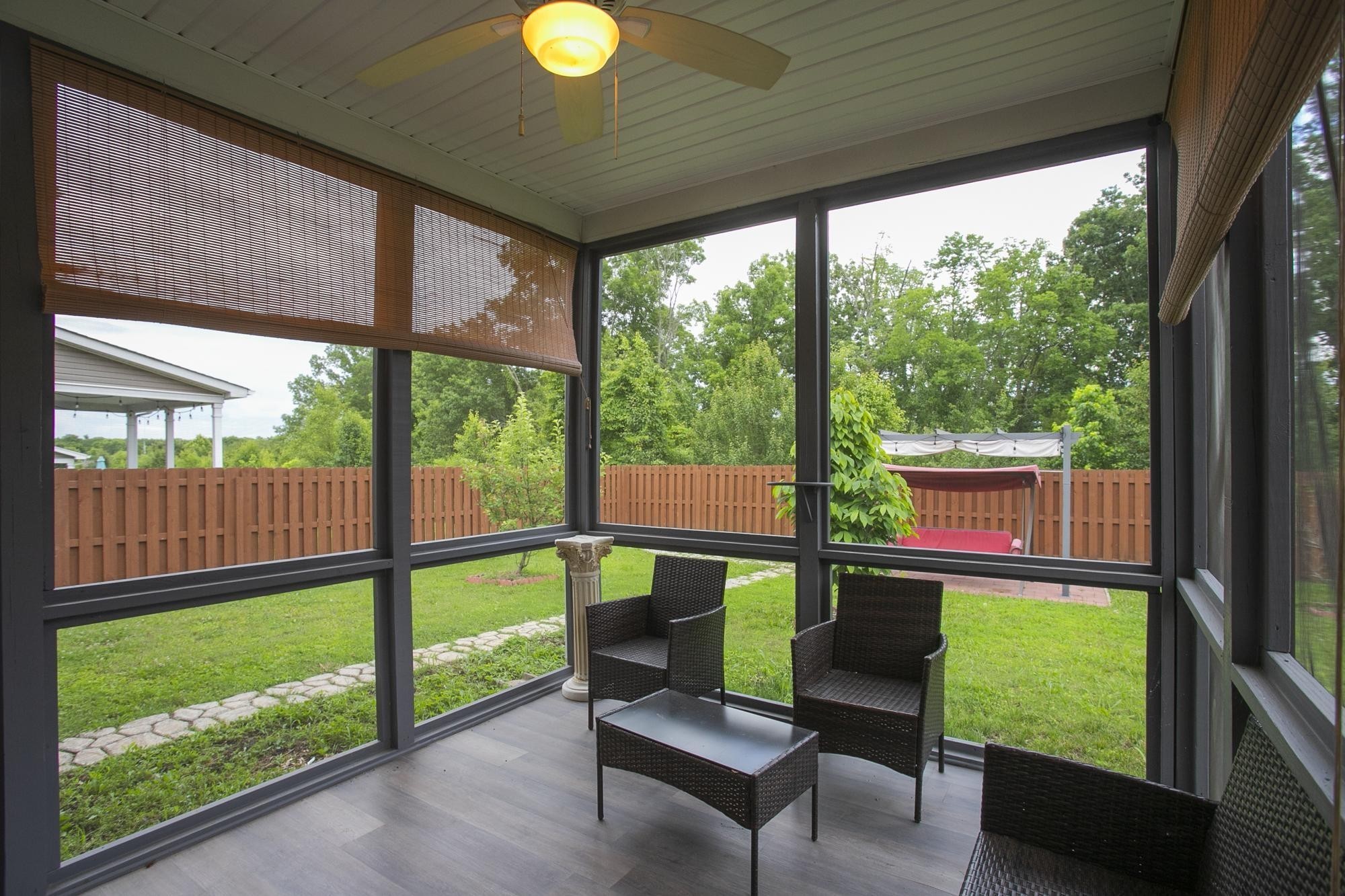 3601 Harpeth Springs Drive Nashville, TN 37221 - Photo 47 of 55 a living room with large windows and wooden floor