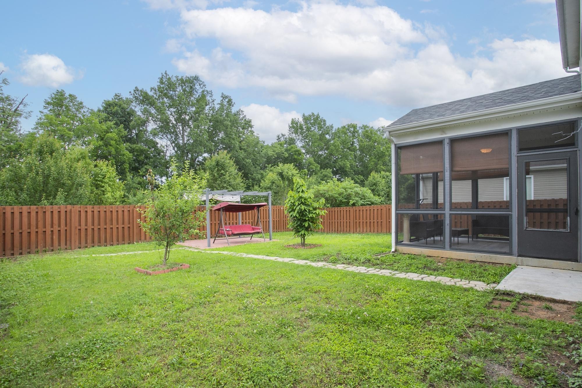 3601 Harpeth Springs Drive Nashville, TN 37221 - Photo 50 of 55 a view of a house with a yard and a large tree