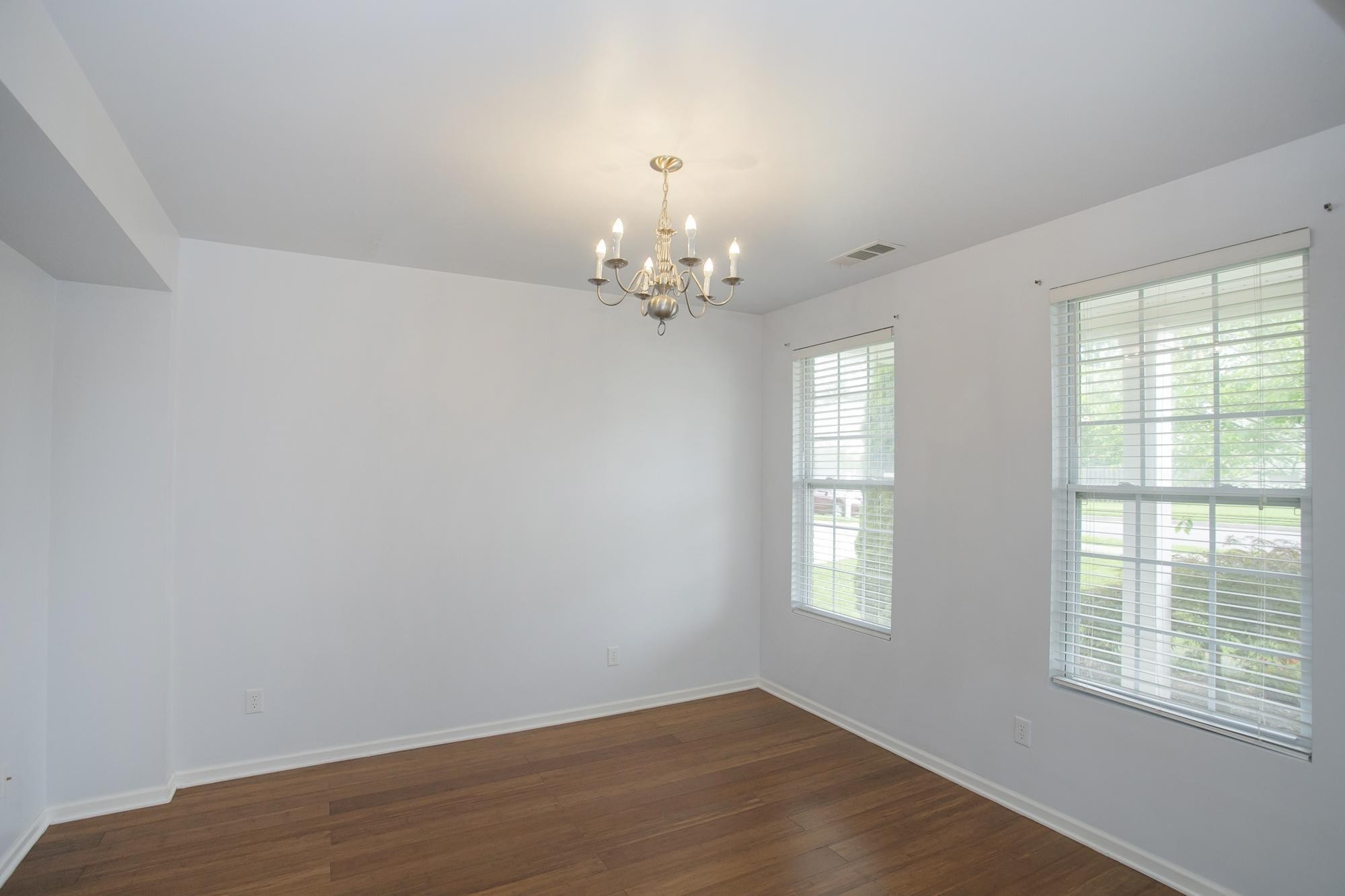 3601 Harpeth Springs Drive Nashville, TN 37221 - Photo 6 of 55 wooden floor in an empty room with a window