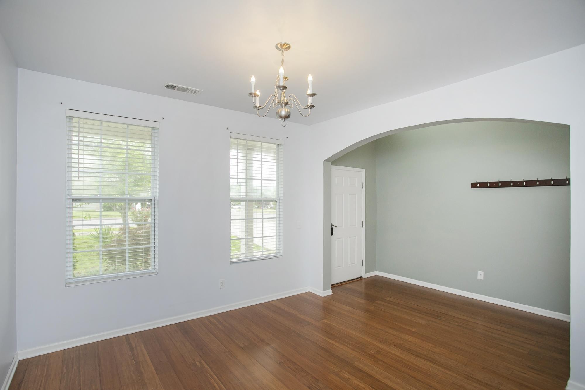 3601 Harpeth Springs Drive Nashville, TN 37221 - Photo 7 of 55 a big room with wooden floor chandelier and windows