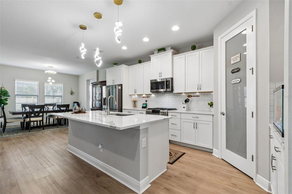 4300 Burdick Loop Odessa, FL 33556 - Photo 8 of 41 a kitchen with white cabinets and sink