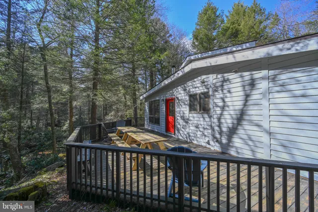 a view of house with a roof deck
