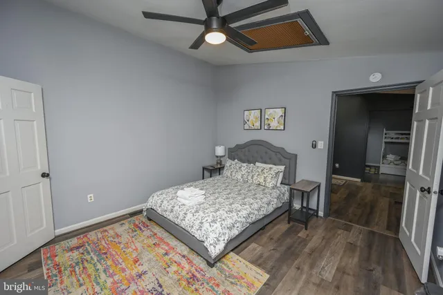 a bedroom with a bed and a walk in closet