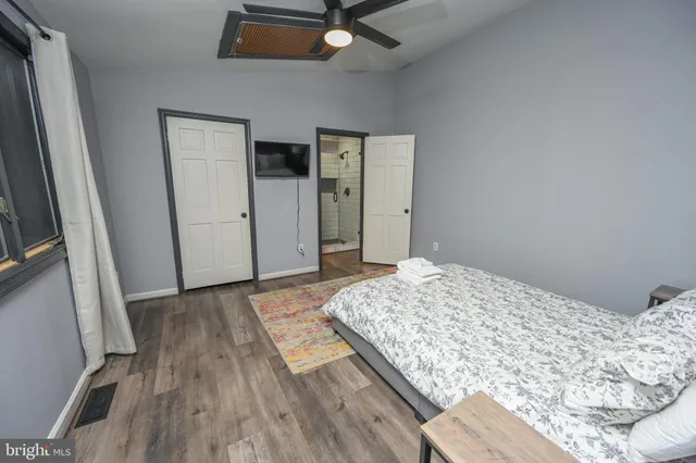 a bedroom with a bed and a dresser