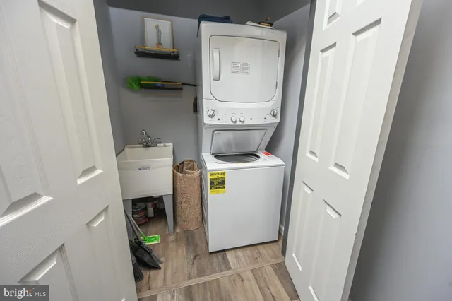 a bathroom with a toilet sink vanity and mirror