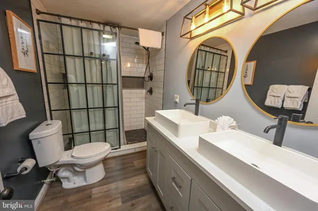 a large bedroom with a bed and glass door