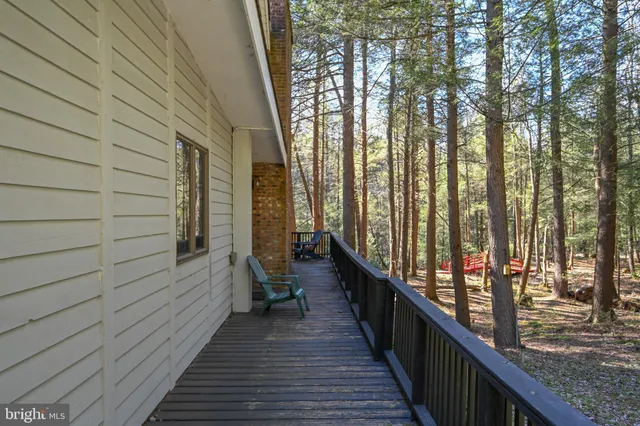 a view of balcony with wooden floor