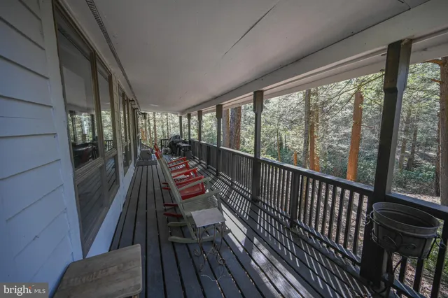 a view of a balcony with chairs