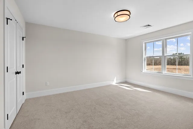 a view of a room with furniture and window