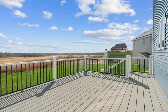 a view of a balcony with wooden floor