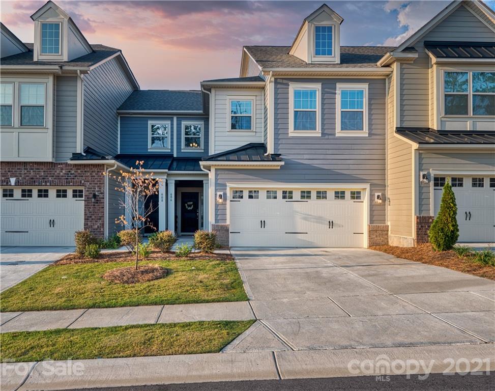 606 Amber Meadows Way Tega Cay, SC 29708 - Photo 1 of 23 a front view of a house with a yard