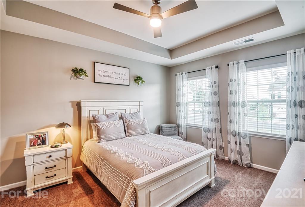 606 Amber Meadows Way Tega Cay, SC 29708 - Photo 12 of 23 a bedroom with a bed and a window
