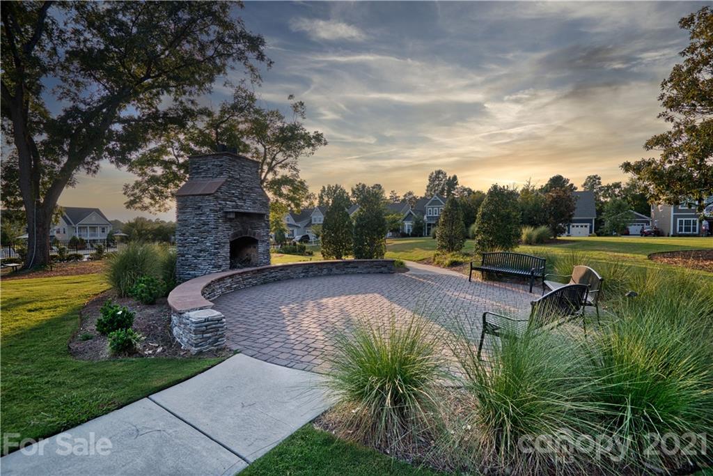 606 Amber Meadows Way Tega Cay, SC 29708 - Photo 22 of 23 a view of a swimming pool and a yard