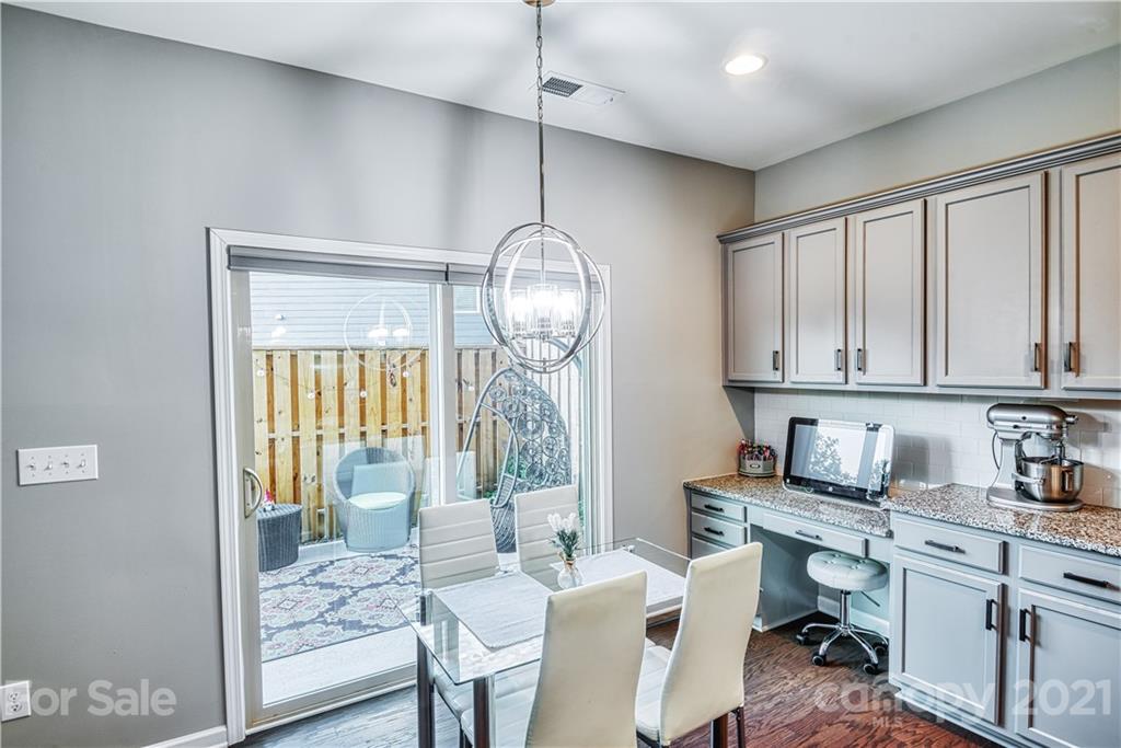 606 Amber Meadows Way Tega Cay, SC 29708 - Photo 5 of 23 a dining room with furniture a chandelier and wooden floor