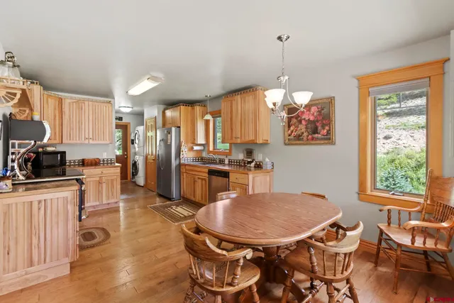 a view of a dining room with furniture window and wooden floor