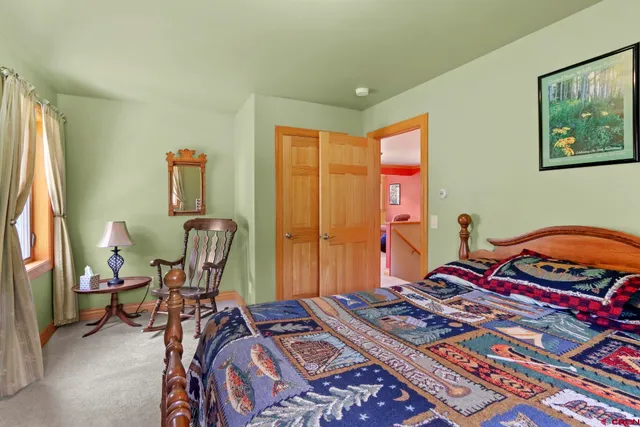 a bedroom with bed and a window