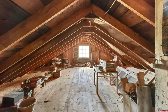 a aerial view of a house with table and chairs