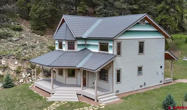 an aerial view of a house with outdoor space