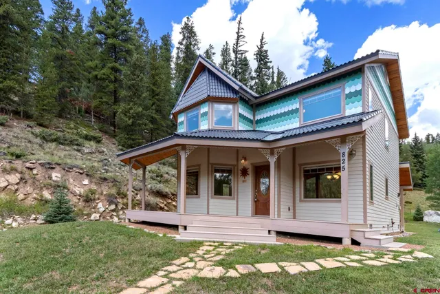 a view of house with yard and entertaining space