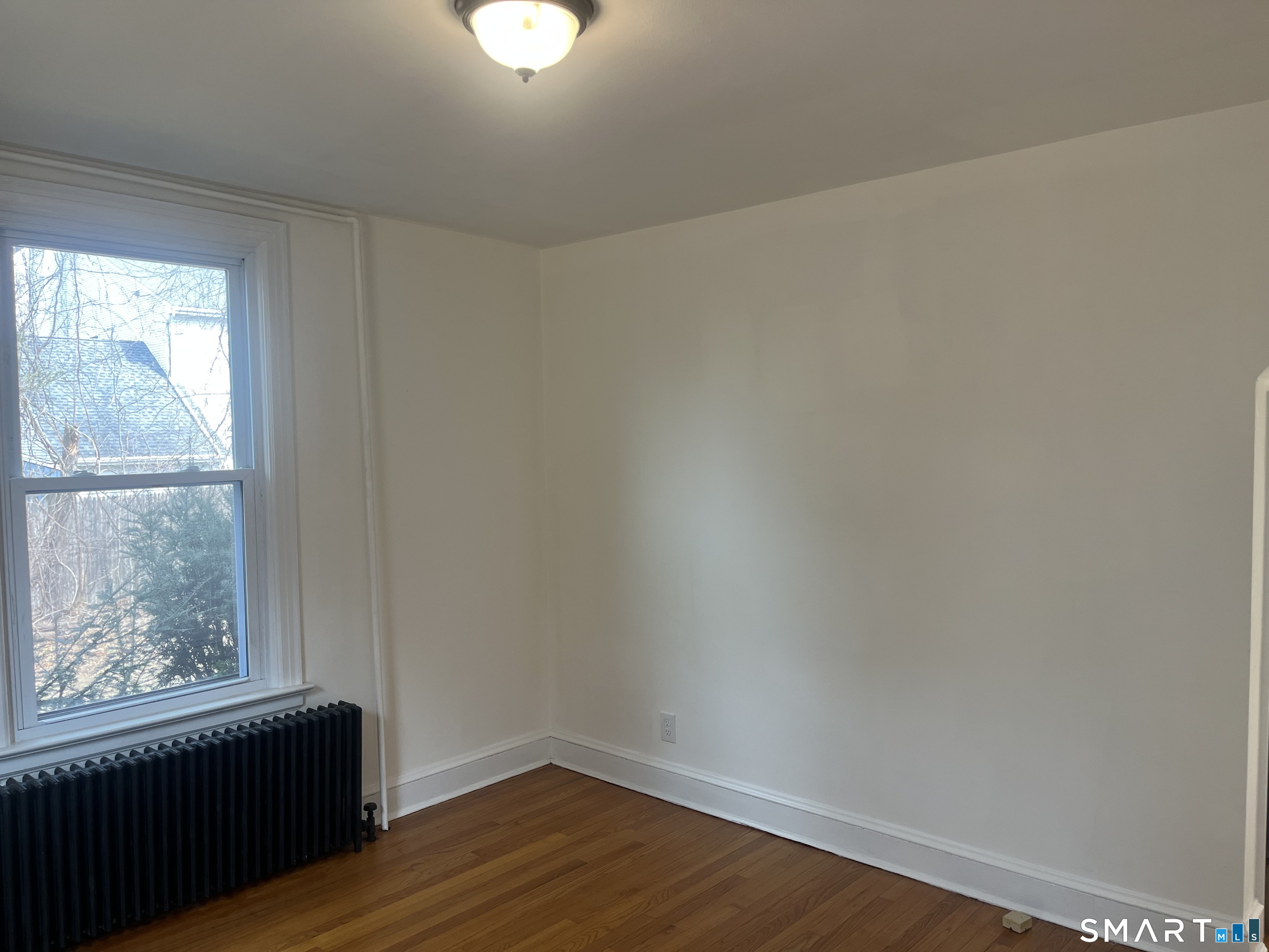156 Union Street, Unit 2 Manchester, CT 06042 - Photo 11 of 16 a view of a small space with wooden floor and a window