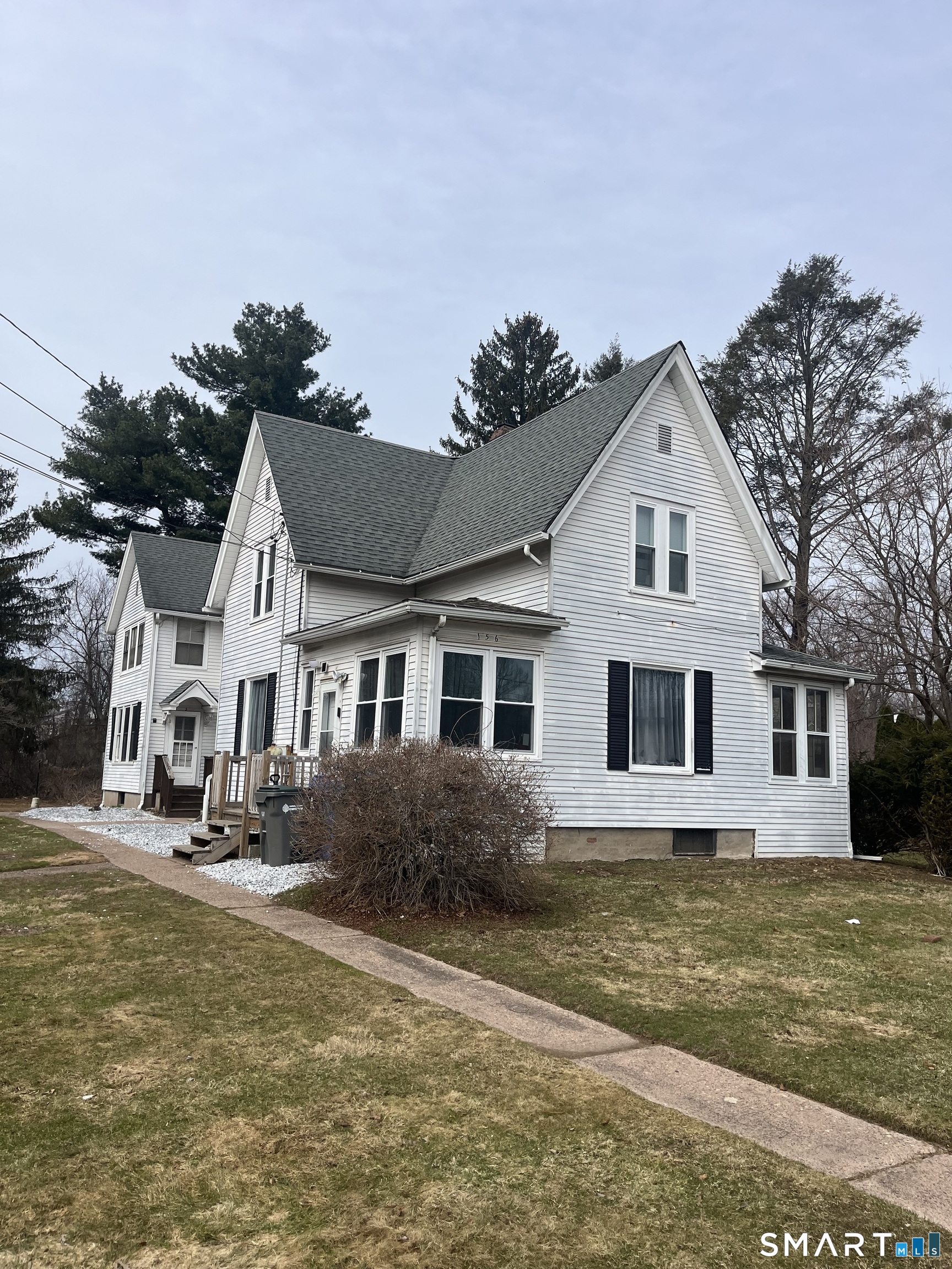 156 Union Street, Unit 2 Manchester, CT 06042 - Photo 16 of 16 a front view of a house with garden