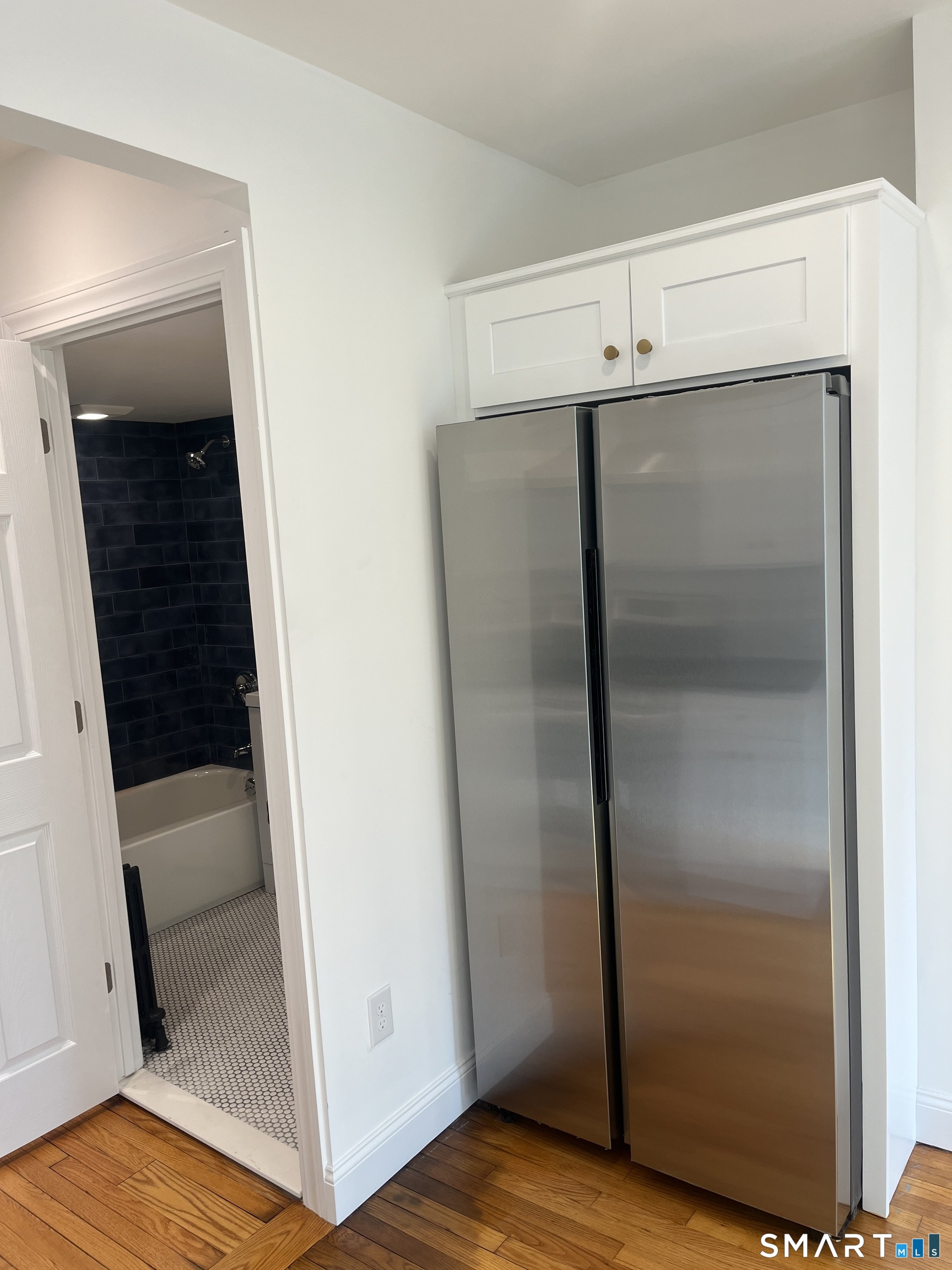 156 Union Street, Unit 2 Manchester, CT 06042 - Photo 5 of 16 a bathroom with a glass door shower and closet