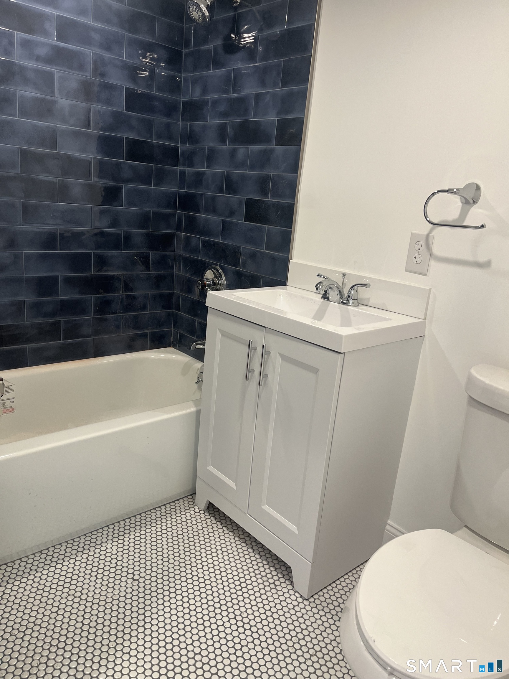156 Union Street, Unit 2 Manchester, CT 06042 - Photo 7 of 16 a bathroom with a sink a toilet and shower