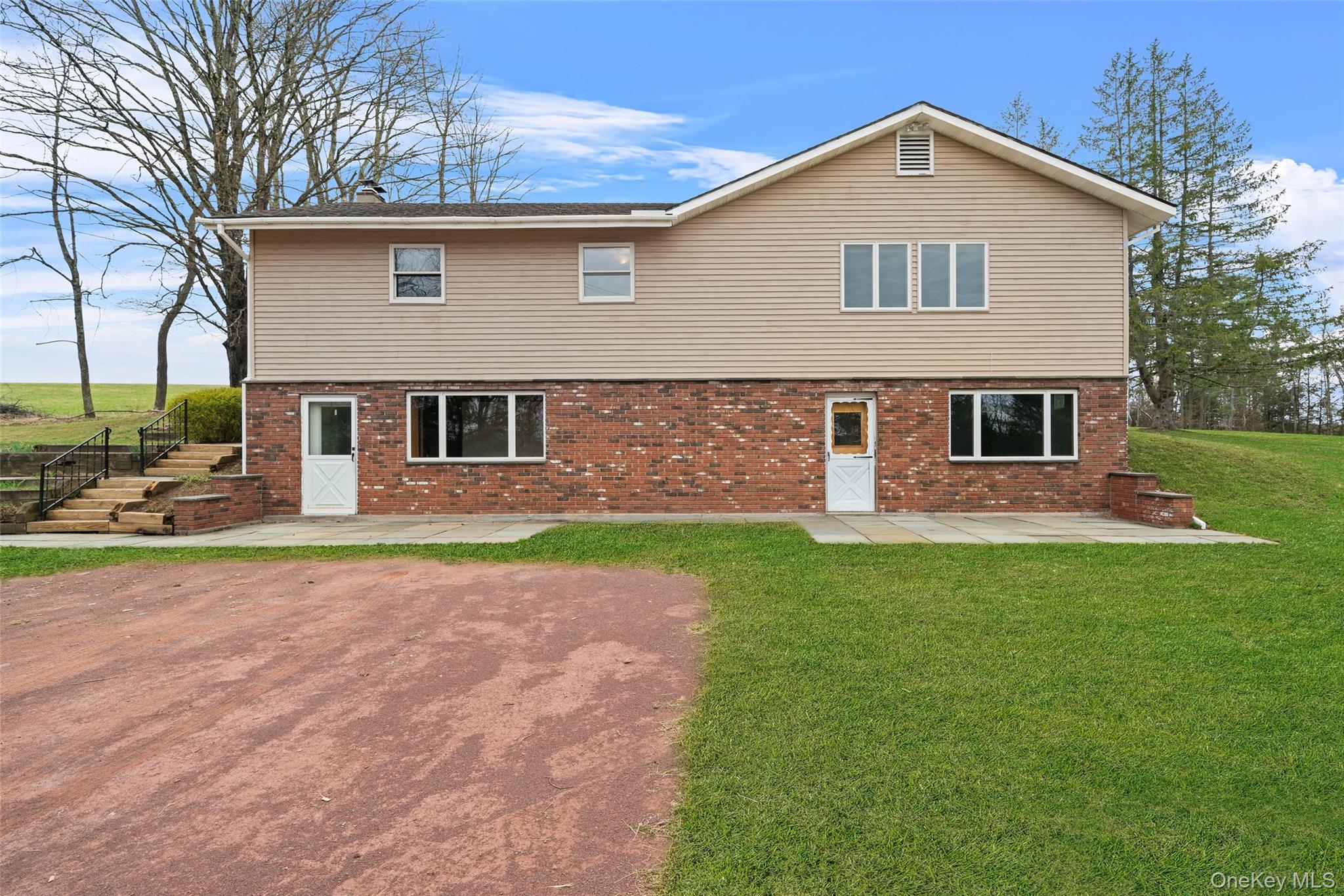 front view of a house with a yard