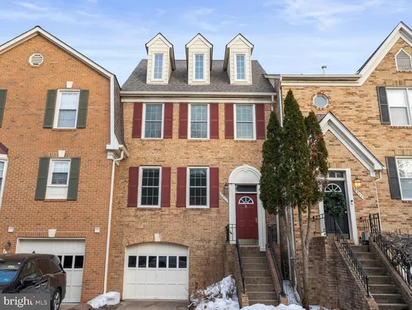 a front view of a residential apartment building with a yard