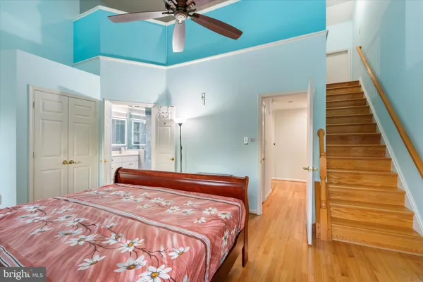 a bedroom with a bed and chandelier