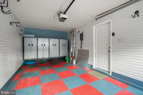 a room with pool table and a rug